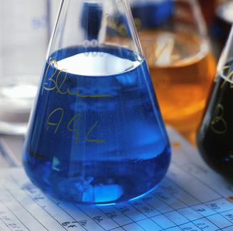 Laboratory beaker with blue liquid
